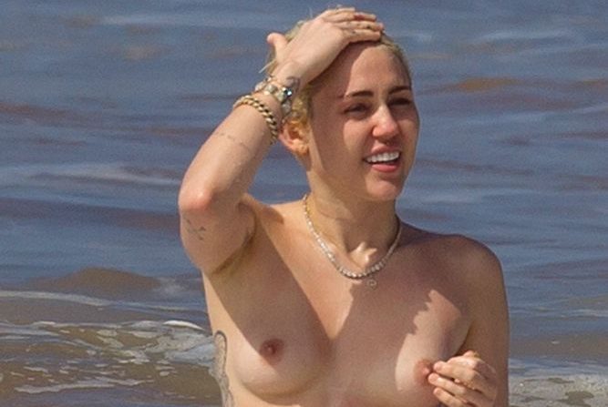 topless miley cyrus showing small tits in beach real