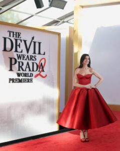 "Anne Hathaway Dazzles in Stunning Red Satin Gown, Showcasing Impressive Cleavage and Curves on the Red Carpet" 10