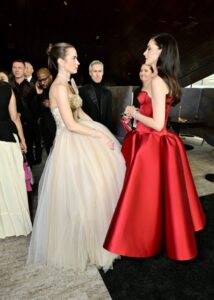 "Anne Hathaway Dazzles in Stunning Red Satin Gown, Showcasing Impressive Cleavage and Curves on the Red Carpet" 18