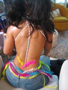 "Chloe Bailey Shines in Sparkling Outfit and Neon Jeans: A Stunning Fashion Moment" 1