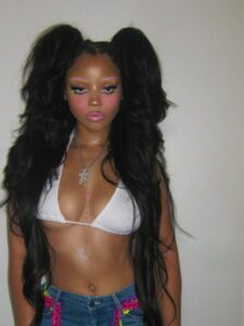 "Chloe Bailey Shines in Sparkling Outfit and Neon Jeans: A Stunning Fashion Moment" 8