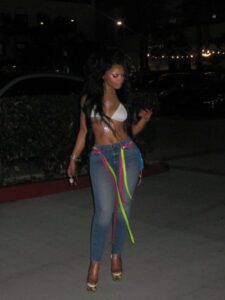 "Chloe Bailey Shines in Sparkling Outfit and Neon Jeans: A Stunning Fashion Moment" 11