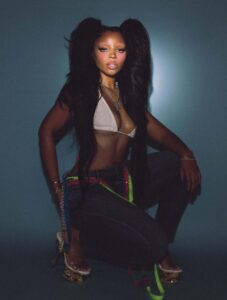 "Chloe Bailey Shines in Sparkling Outfit and Neon Jeans: A Stunning Fashion Moment" 13