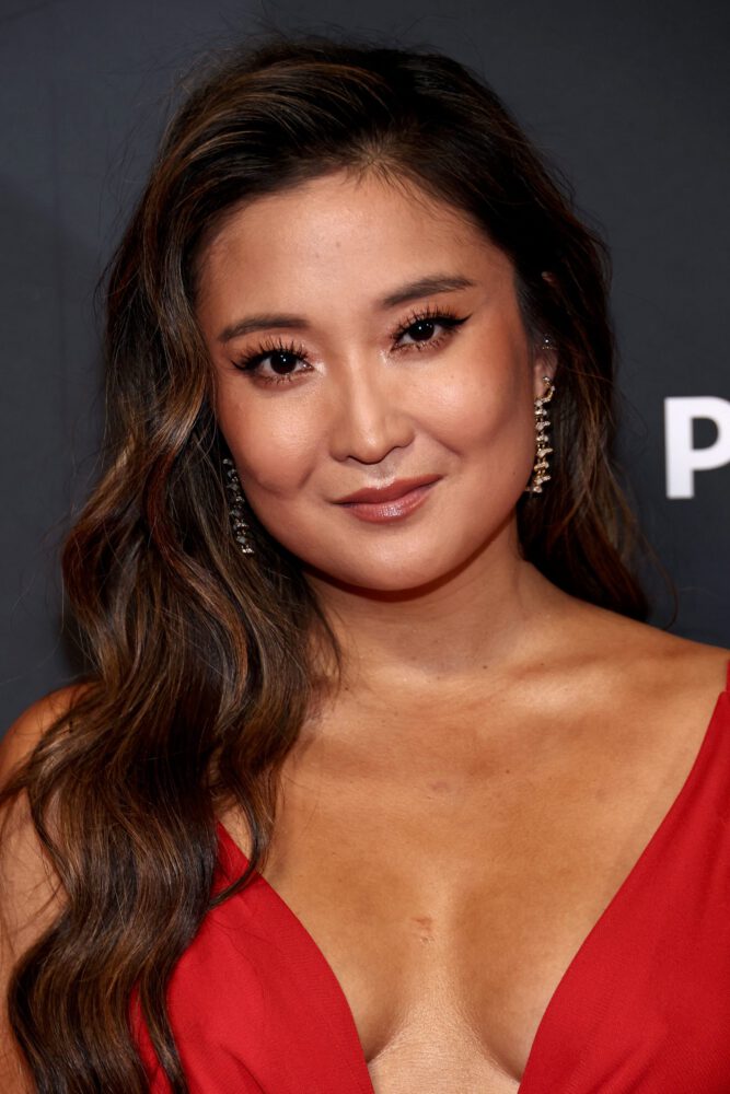 New Ashley Park Flashes Major Cleavage in That Tight Red Gown at Emily in Paris Screening Photos