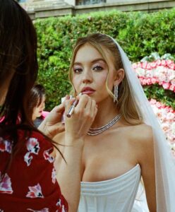 "Sydney Sweeney Dazzles in Figure-Hugging Wedding Dress, Showcasing Stunning Cleavage in Euphoria" 9