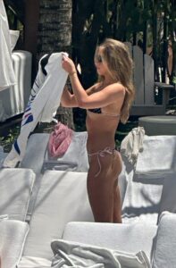 "Tate McRae Stuns in Daring String Bikini by the Pool in Miami" 11