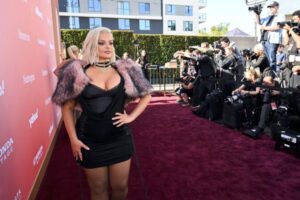 "Bebe Rexha Dazzles in Bold Red Carpet Look, Flaunting Her Curvy Figure and Stunning Assets" 19