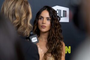 "Eiza Gonzalez Dazzles in Figure-Hugging Gold Dress at SF Film Fest, Showcasing Bold Braless Look" 12