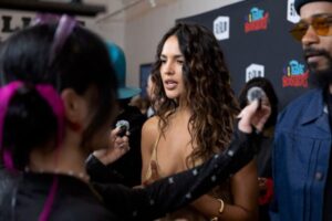 "Eiza Gonzalez Dazzles in Figure-Hugging Gold Dress at SF Film Fest, Showcasing Bold Braless Look" 13