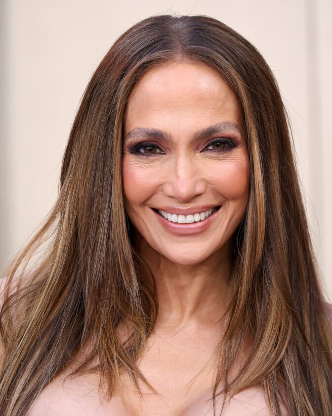 Jennifer Lopez Dazzles in Sheer Gown, Showcasing Stunning Cleavage at Office Romance Premiere