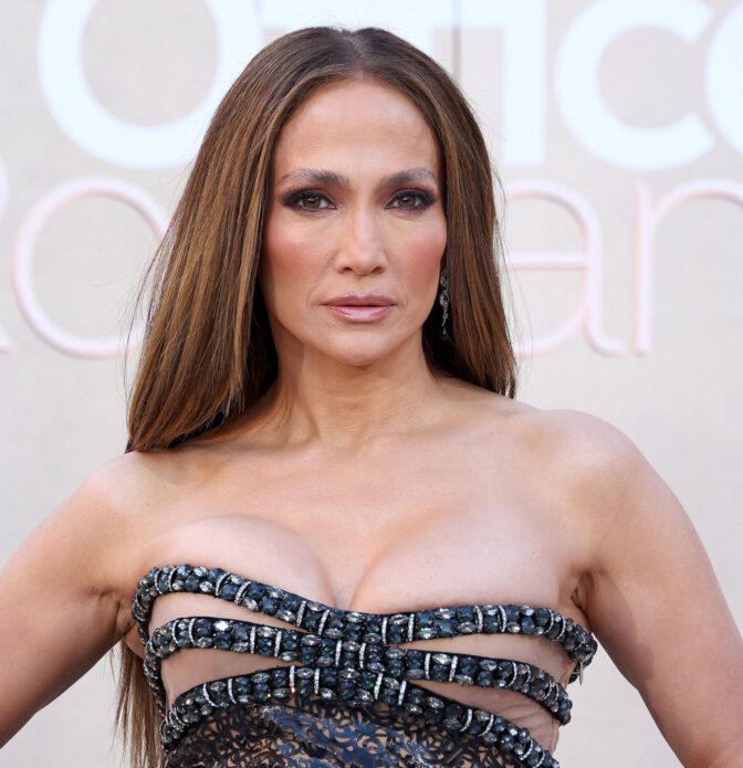 Jennifer Lopez Dazzles in Sheer Gown, Showcasing Stunning Cleavage at Office Romance Premiere