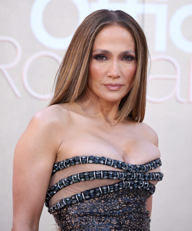 Jennifer Lopez Dazzles in Sheer Gown, Showcasing Stunning Cleavage at Office Romance Premiere