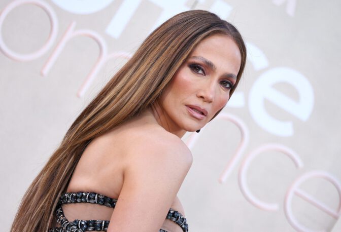 Jennifer Lopez Dazzles in Sheer Gown, Showcasing Stunning Cleavage at Office Romance Premiere
