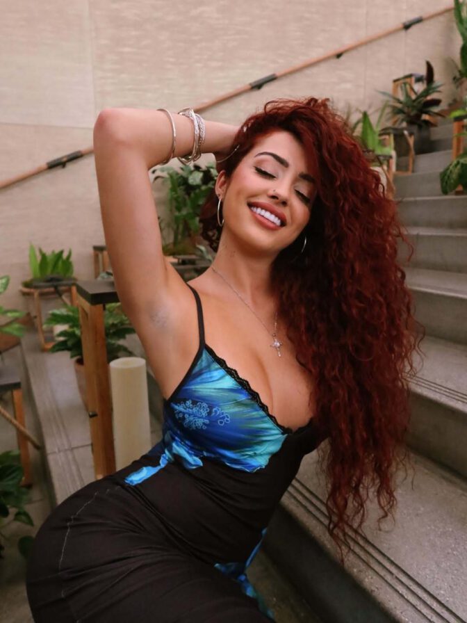 Malu Trevejo Showcases Stunning Curves and Bold Cleavage in Form-Fitting Lace Dress
