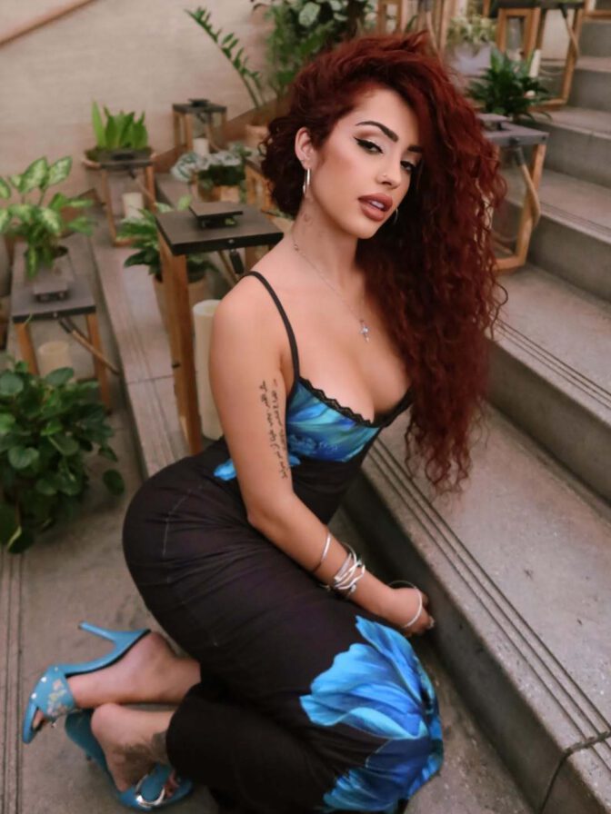 Malu Trevejo Showcases Stunning Curves and Bold Cleavage in Form-Fitting Lace Dress