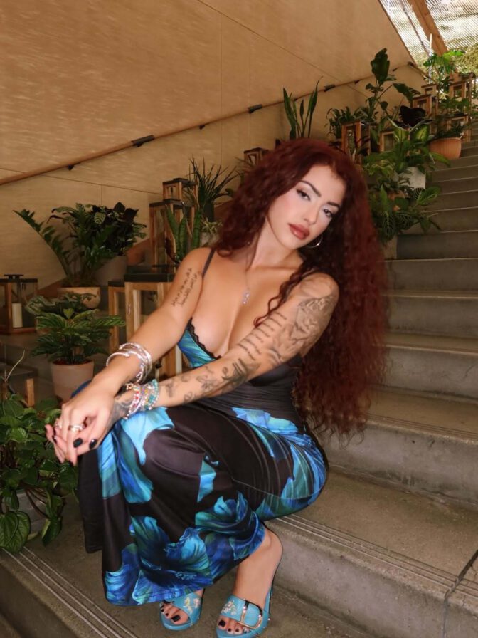 Malu Trevejo Showcases Stunning Curves and Bold Cleavage in Form-Fitting Lace Dress