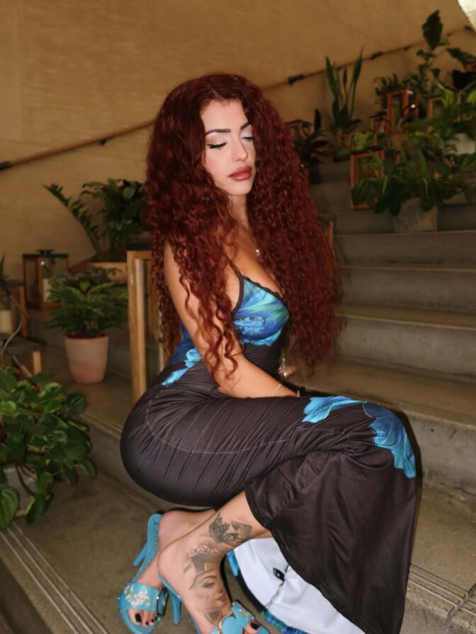 Malu Trevejo Showcases Stunning Curves and Bold Cleavage in Form-Fitting Lace Dress