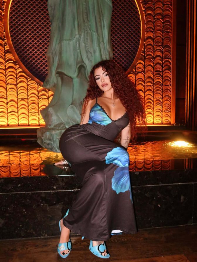 Malu Trevejo Showcases Stunning Curves and Bold Cleavage in Form-Fitting Lace Dress