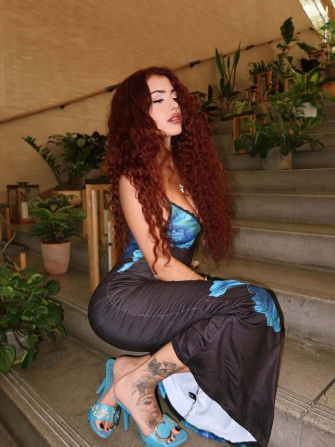 Malu Trevejo Showcases Stunning Curves and Bold Cleavage in Form-Fitting Lace Dress