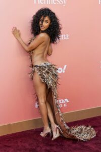 "Tyla Stuns in Daring Feather Ensemble, Showcasing Her Flawless Figure at Billboard Women in Music Event" 27