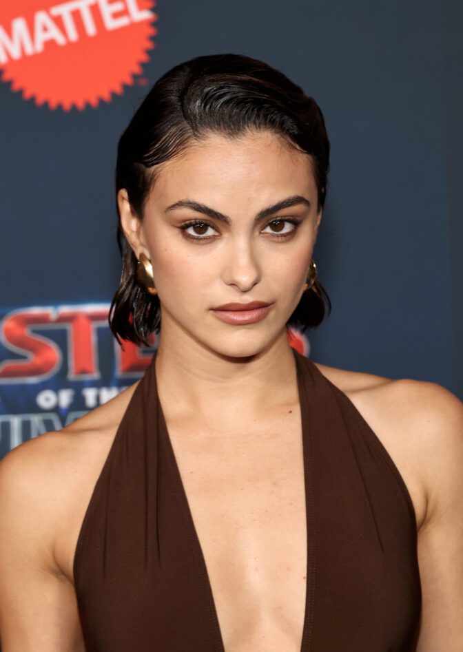 Camila Mendes Stuns in Daring Plunging Brown Halter Gown at Masters of the Universe Premiere