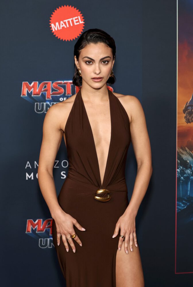 Camila Mendes Stuns in Daring Plunging Brown Halter Gown at Masters of the Universe Premiere