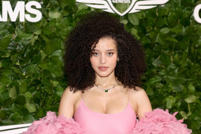 Chase Infiniti Turns Heads in Daring Pink Slip Dress, Showcasing Stunning Cleavage