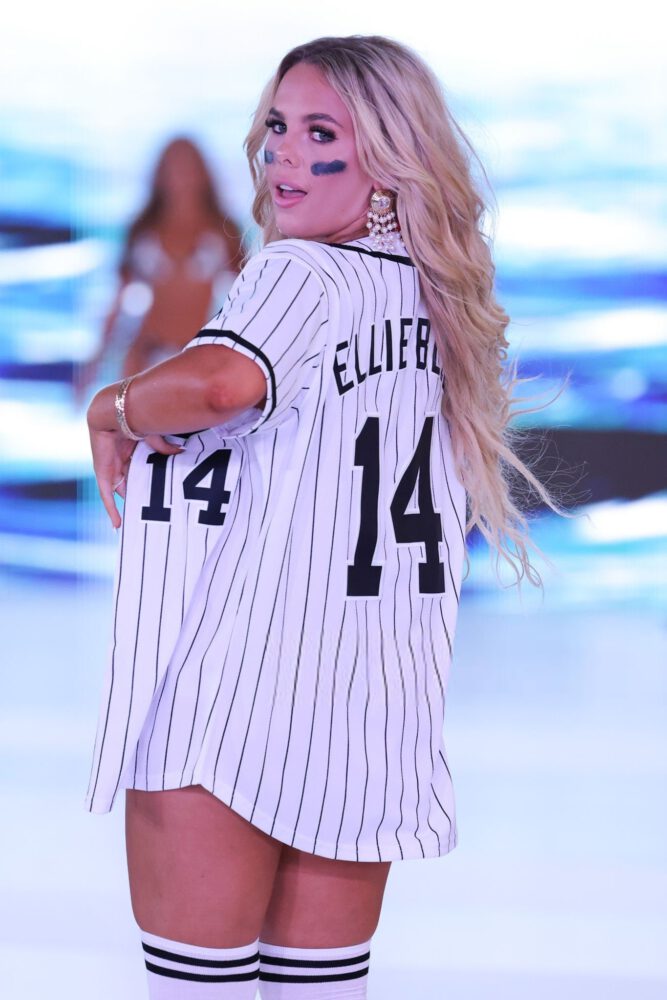 Ellie Blue Dazzles in Form-Fitting Baseball Jersey, Showcasing Stunning Cleavage and Toned Abs at Miami Swim Week