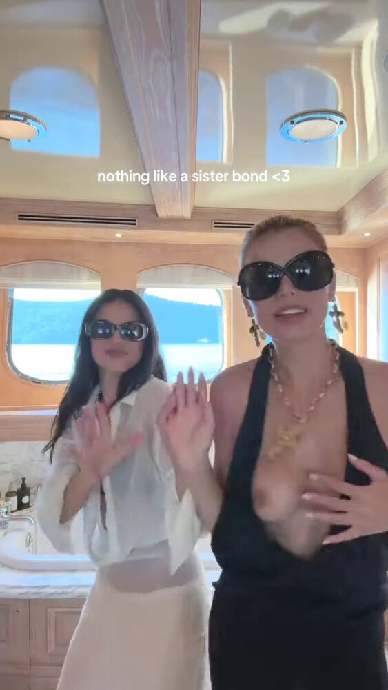Brooks Nader Suffers Epic Boob Flash in Jaw-Dropping Black Gown While Dancing on Yacht with Sister Exposing Major Cleavage in Naughty NSFW Moment