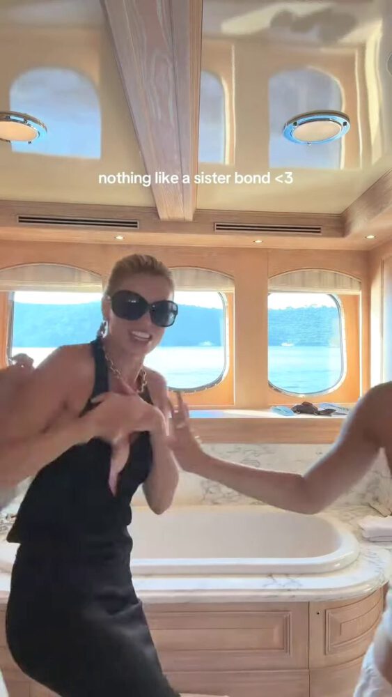 Brooks Nader Suffers Epic Boob Flash in Jaw-Dropping Black Gown While Dancing on Yacht with Sister Exposing Major Cleavage in Naughty NSFW Moment