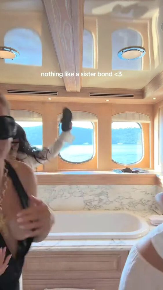 Brooks Nader Suffers Epic Boob Flash in Jaw-Dropping Black Gown While Dancing on Yacht with Sister Exposing Major Cleavage in Naughty NSFW Moment