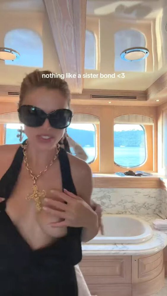 Brooks Nader Suffers Epic Boob Flash in Jaw-Dropping Black Gown While Dancing on Yacht with Sister Exposing Major Cleavage in Naughty NSFW Moment