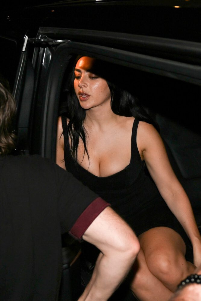 Charli XCX Sizzles in Skintight Parisian Getup with Jaw Dropping Cleavage Flash and Busty Boobs on Full Display