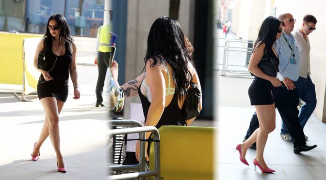 Charli XCX Sizzles in Sultry Black Mini Dress Exposing Lace Lingerie and Toned Legs at BBC Radio 1 Appearance