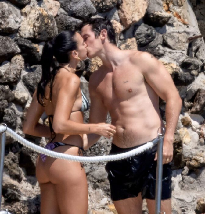 Dua Lipa Exposes Her Nude Tits and Bare Ass on a Rocky Beach with Callum Turner in a Sizzling Topless Display