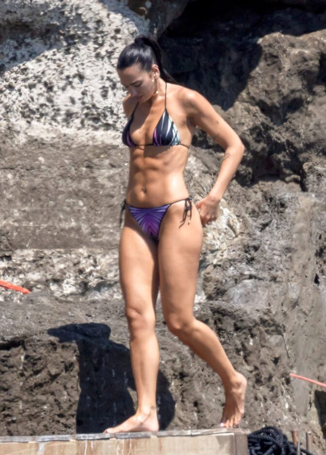 Dua Lipa Exposes Her Nude Tits and Bare Ass on a Rocky Beach with Callum Turner in a Sizzling Topless Display
