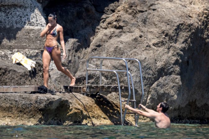 Dua Lipa Exposes Her Nude Tits and Bare Ass on a Rocky Beach with Callum Turner in a Sizzling Topless Display