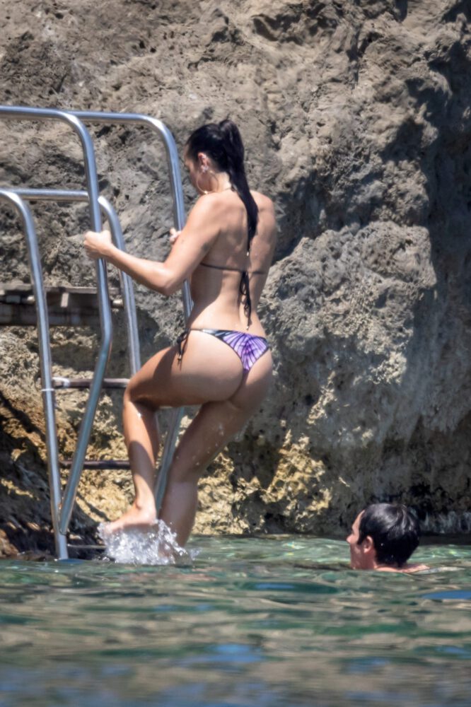 Dua Lipa Exposes Her Nude Tits and Bare Ass on a Rocky Beach with Callum Turner in a Sizzling Topless Display
