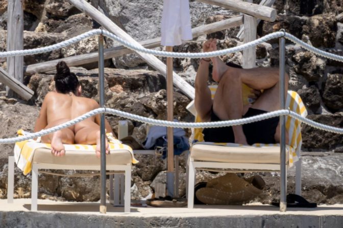 Dua Lipa Exposes Her Nude Tits and Bare Ass on a Rocky Beach with Callum Turner in a Sizzling Topless Display
