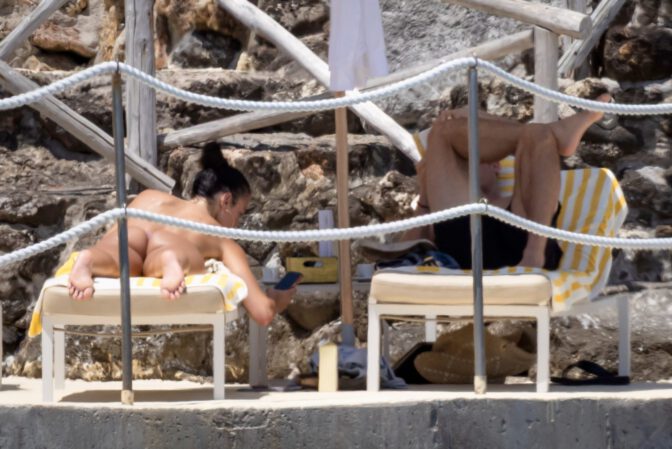 Dua Lipa Exposes Her Nude Tits and Bare Ass on a Rocky Beach with Callum Turner in a Sizzling Topless Display