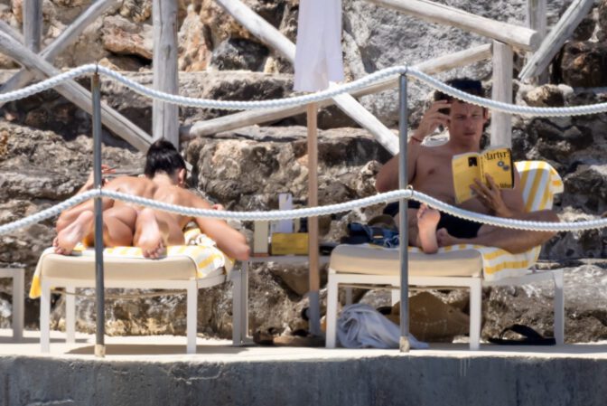 Dua Lipa Exposes Her Nude Tits and Bare Ass on a Rocky Beach with Callum Turner in a Sizzling Topless Display