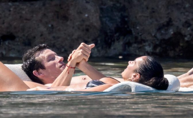 Dua Lipa Exposes Her Nude Tits and Bare Ass on a Rocky Beach with Callum Turner in a Sizzling Topless Display