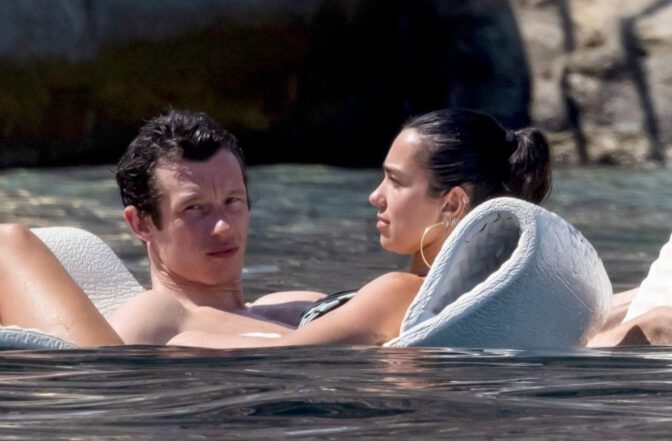 Dua Lipa Exposes Her Nude Tits and Bare Ass on a Rocky Beach with Callum Turner in a Sizzling Topless Display