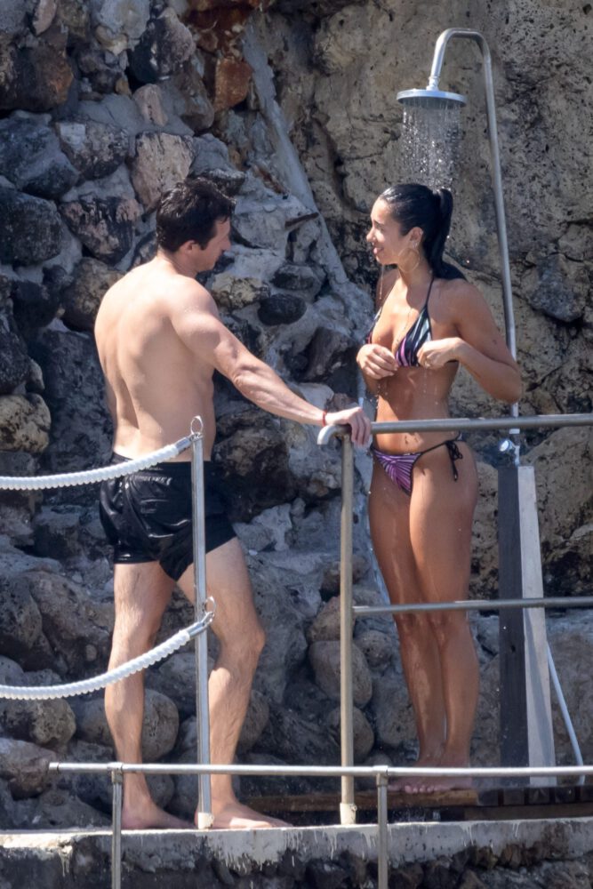 Dua Lipa Exposes Her Nude Tits and Bare Ass on a Rocky Beach with Callum Turner in a Sizzling Topless Display