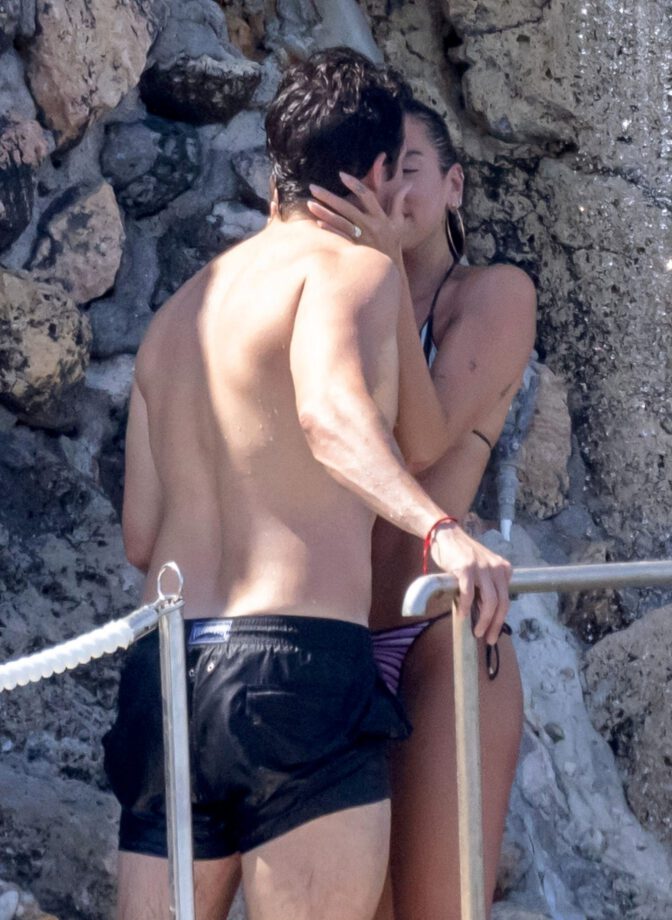 Dua Lipa Exposes Her Nude Tits and Bare Ass on a Rocky Beach with Callum Turner in a Sizzling Topless Display
