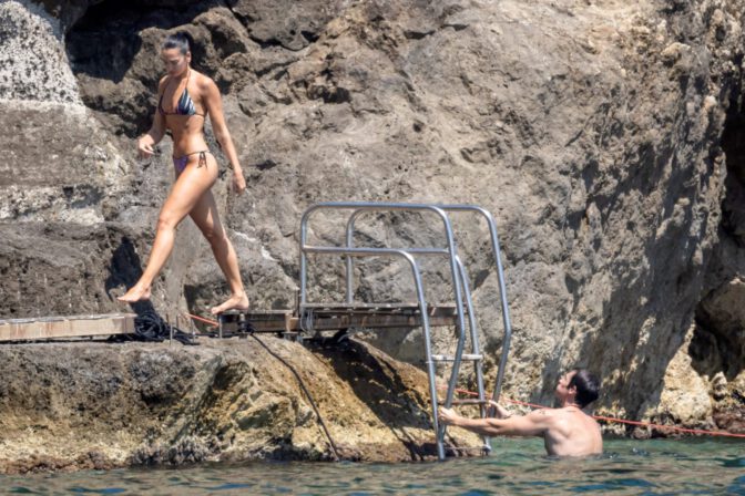 Dua Lipa Exposes Her Nude Tits and Bare Ass on a Rocky Beach with Callum Turner in a Sizzling Topless Display