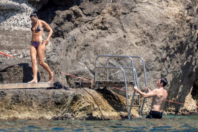 Dua Lipa Exposes Her Nude Tits and Bare Ass on a Rocky Beach with Callum Turner in a Sizzling Topless Display