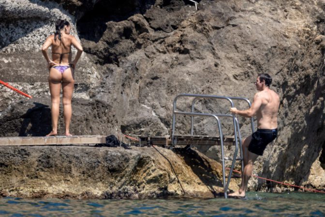 Dua Lipa Exposes Her Nude Tits and Bare Ass on a Rocky Beach with Callum Turner in a Sizzling Topless Display