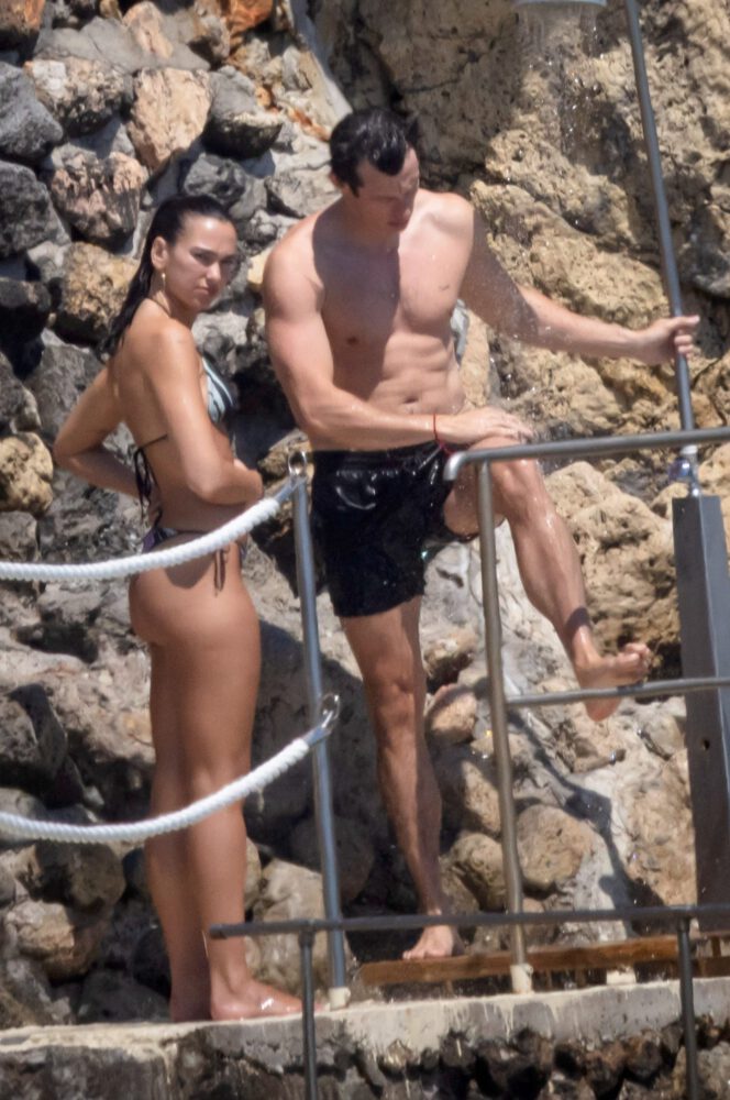 Dua Lipa Exposes Her Nude Tits and Bare Ass on a Rocky Beach with Callum Turner in a Sizzling Topless Display