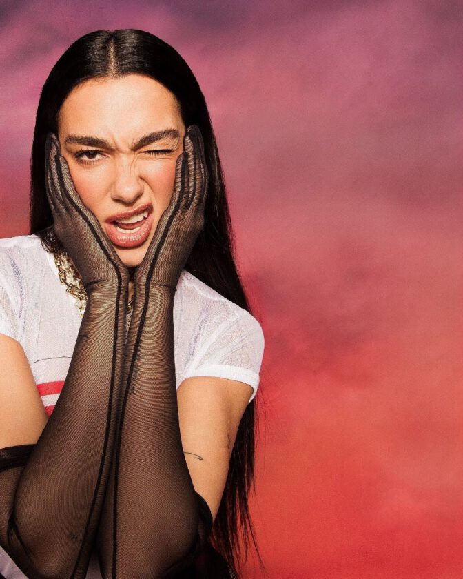 Dua Lipa Goes Totally Sheer in a Clinging Wet-Look Tee and Fishnets for Sexy New Photoshoot